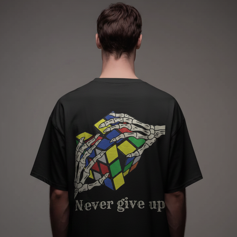 Oversized black unisex tee with skeleton hand Rubik's cube graphic and Never give up text